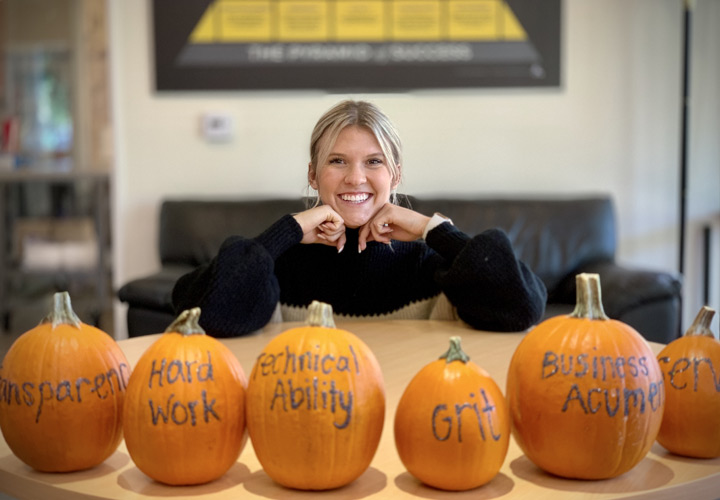 GC Team Member Posing with Pumpkins