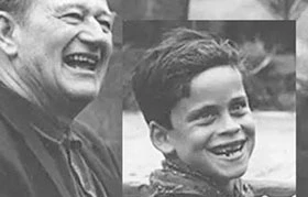 old photo of john wayne with his son