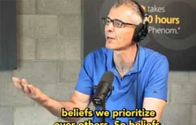 Man talking saying "Beliefs we prioritize every others"