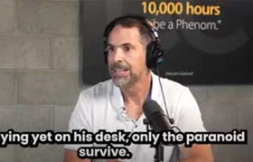 man talking "...yet on his desk, only the paranoid survive."